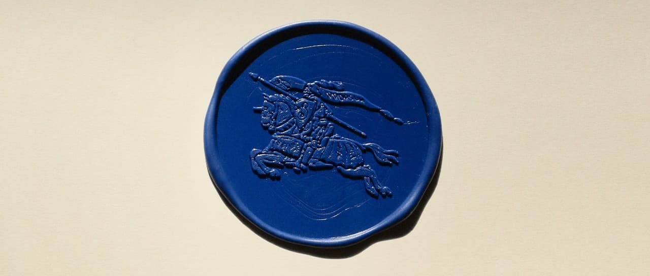 Burberry’s Equestrian Knight Design impressed into a blue wax seal