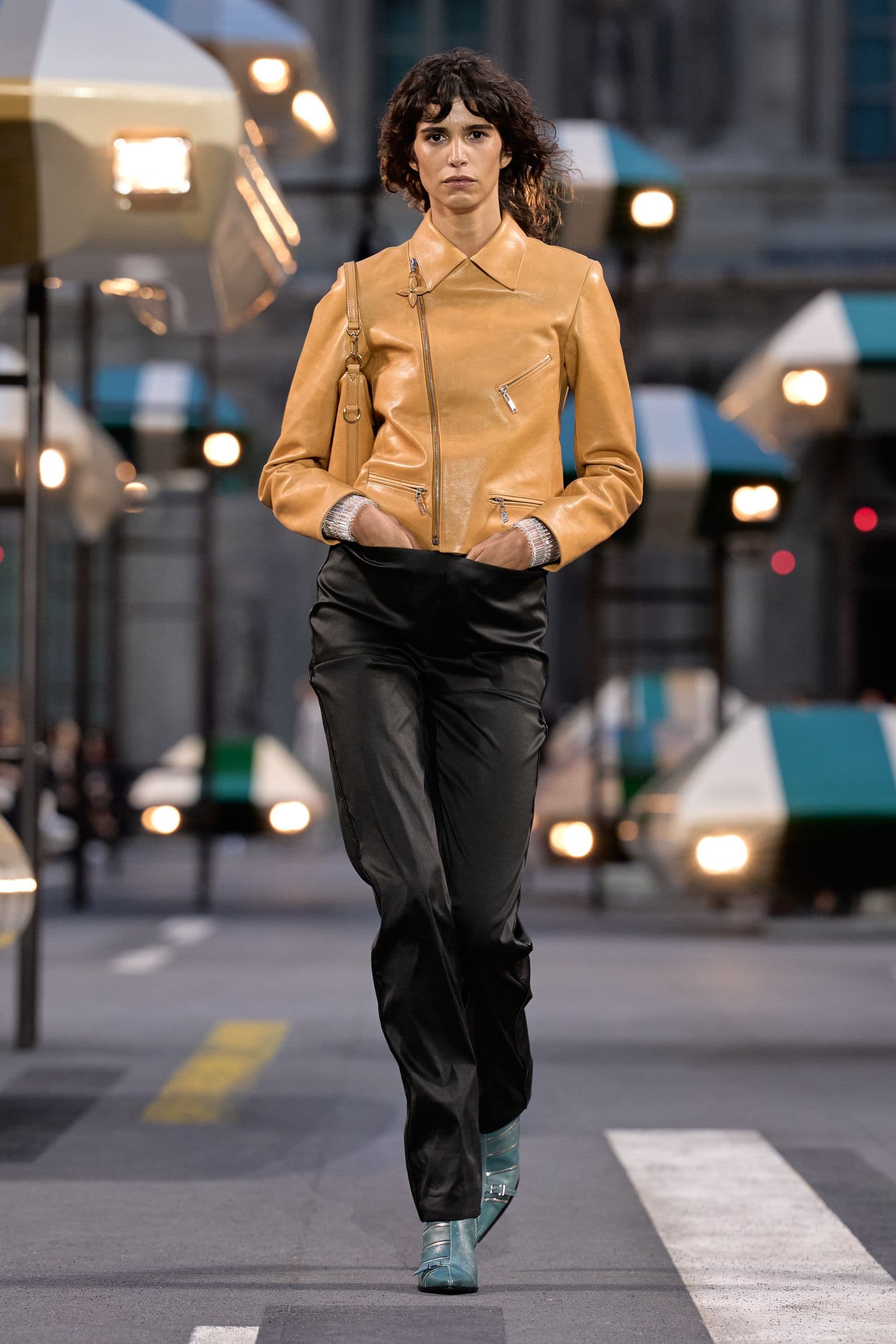 Look 13: a tan cropped zip jacket with loose black trousers