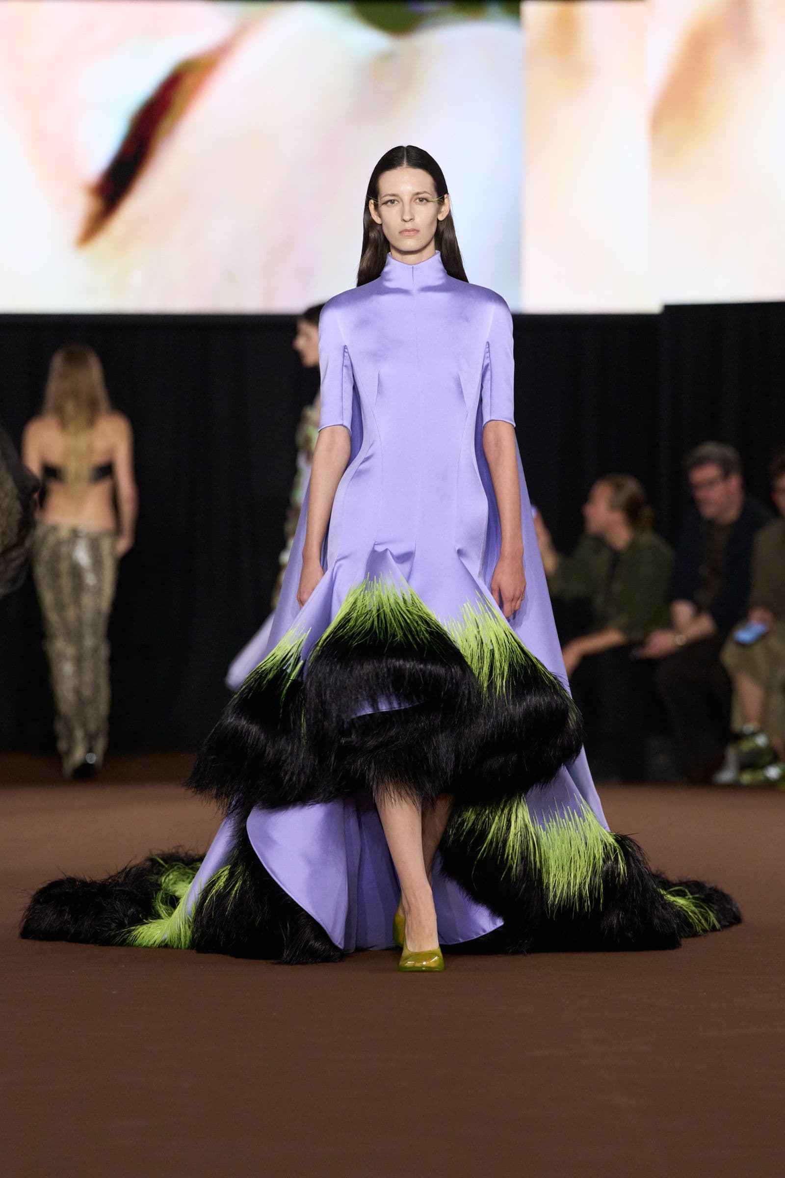 Mugler Spring 2027 look 43: lilac dress with black and green feathered skirt
