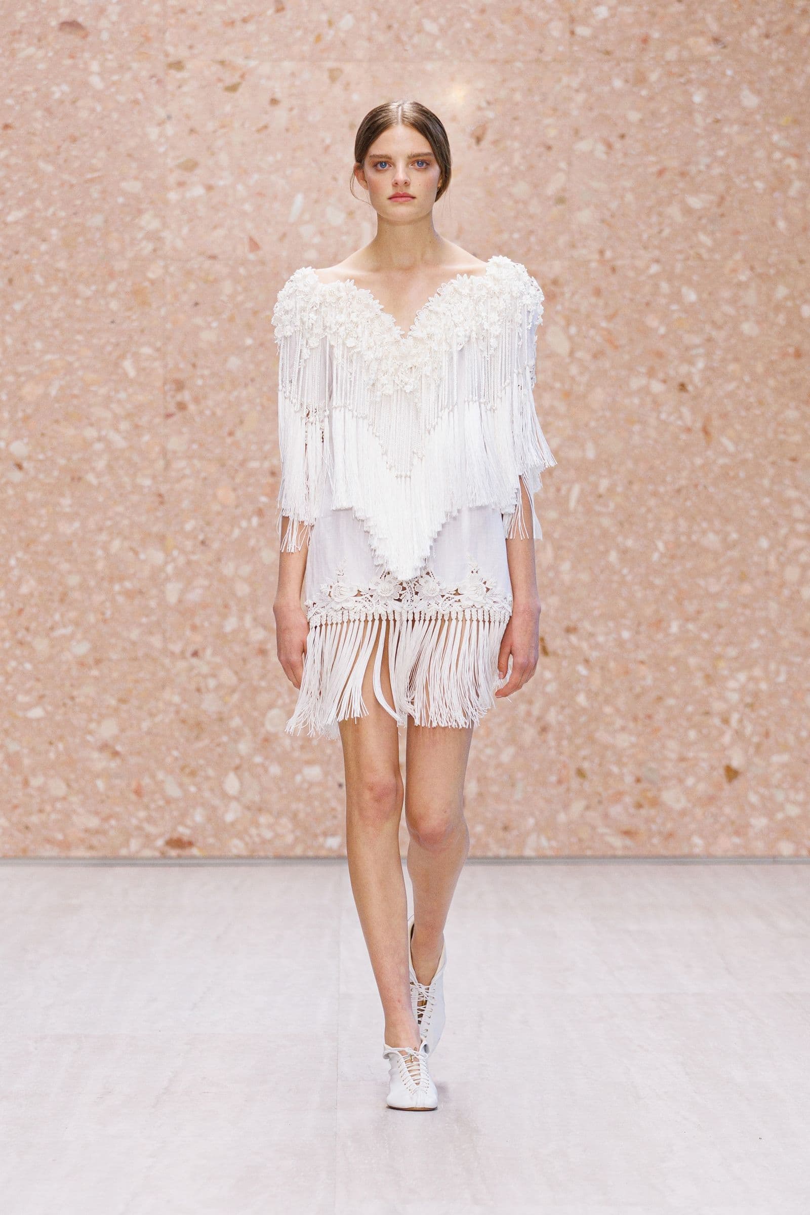 Look 1: white lace and fringe with an open shoulder line