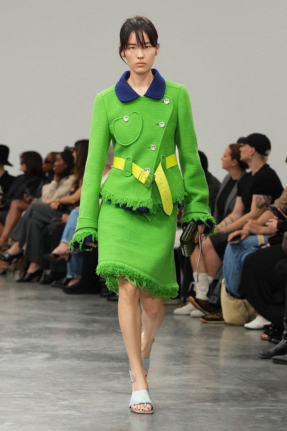 Courrèges Spring 2027 look 33: lime jacket and skirt with contrasting blue collar